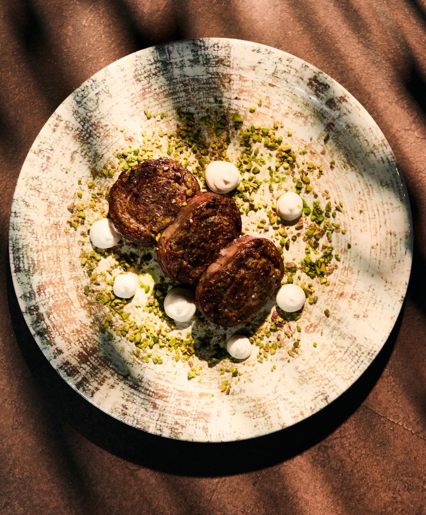 A carefully presented dish from AQUA