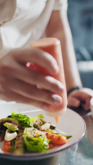A salad being finished in the Dieci Moda kitchen