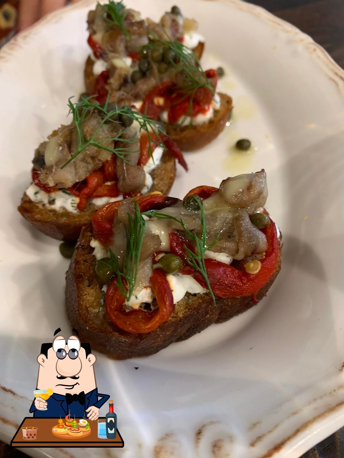 A dish served on toasted bread at Habak Potato Co.