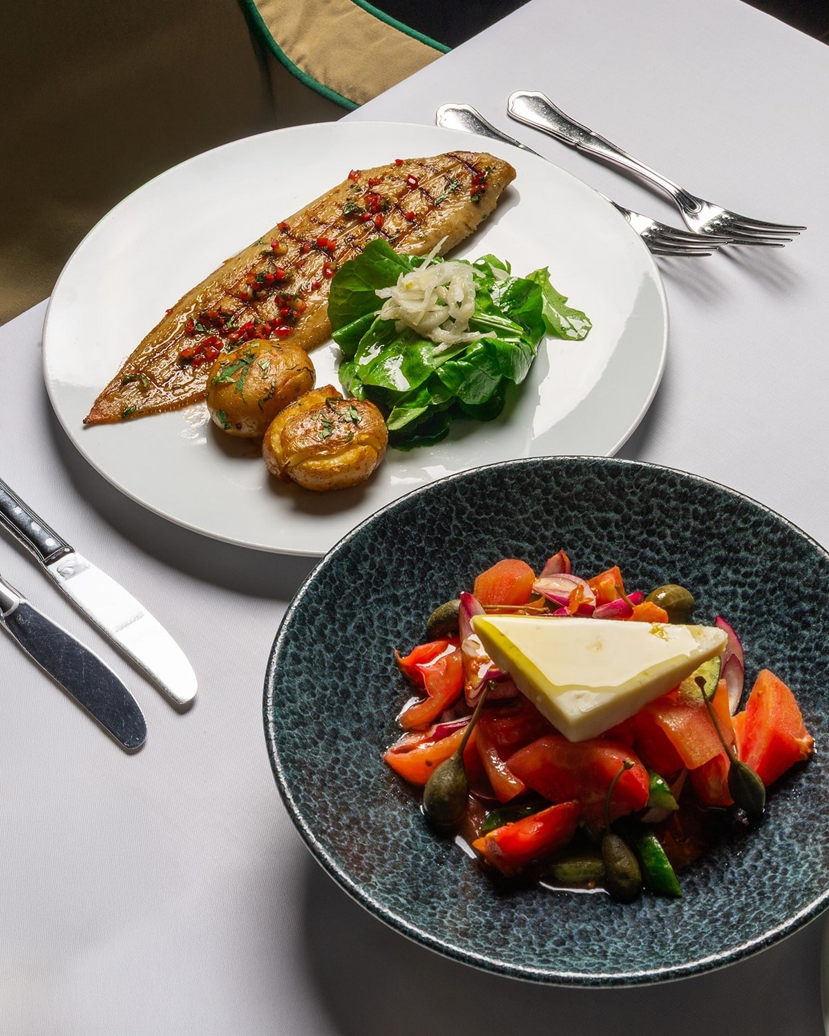 a view of the food and setting at liman istanbul