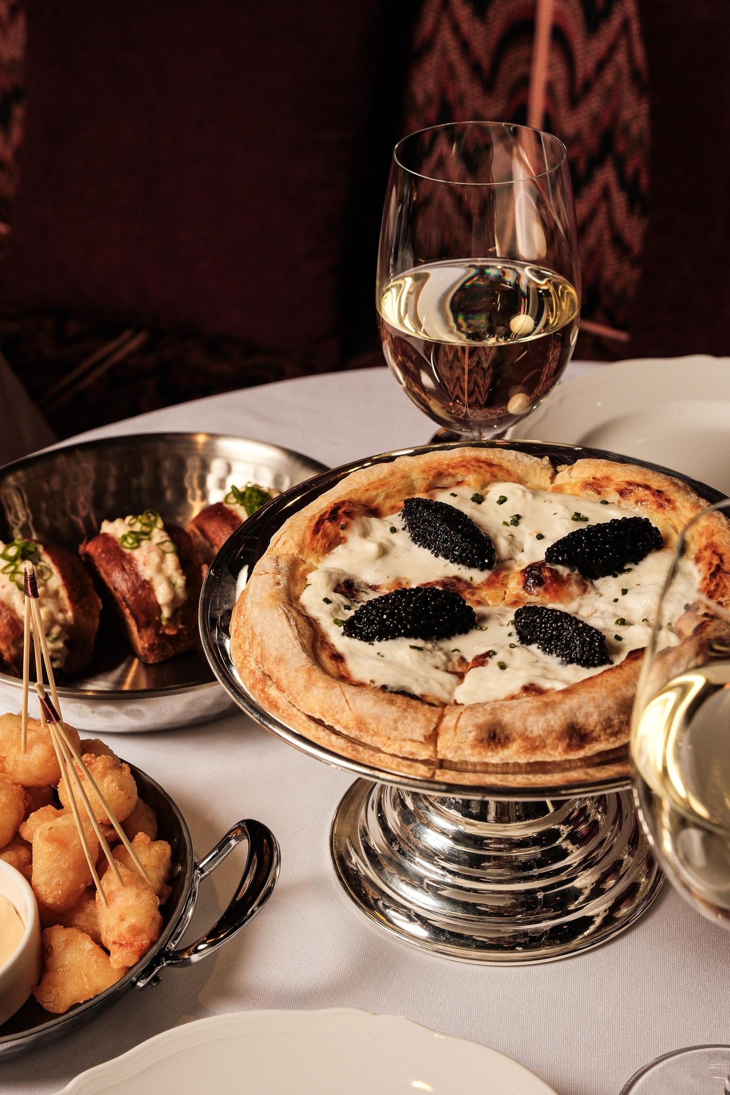 Caviar-topped pizza and wine at Mondaine de Pariso Istanbul